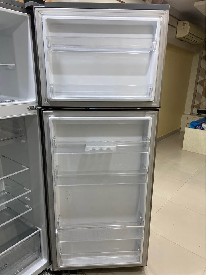 LG 343L 3 Star GL-S382SDSX refrigerator with open side door compartments, showing multiple door shelves and storage space
