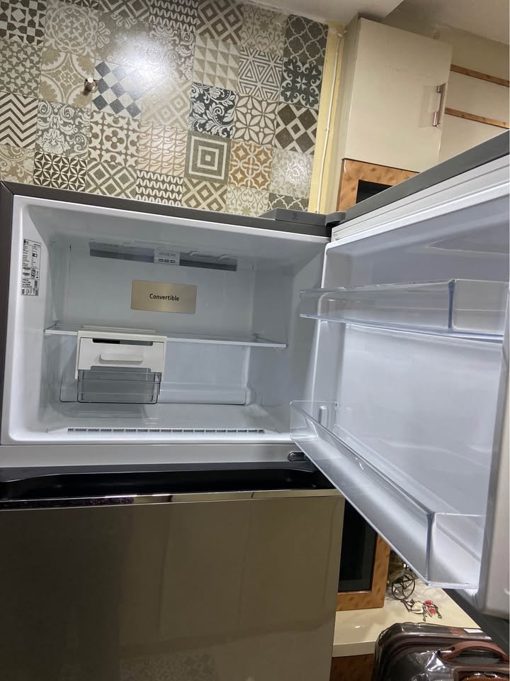 LG 343L 3 Star GL-S382SDSX Top freezer refrigerator with open door, showing a clean convertible freezer compartment, shelf, and built-in door storage