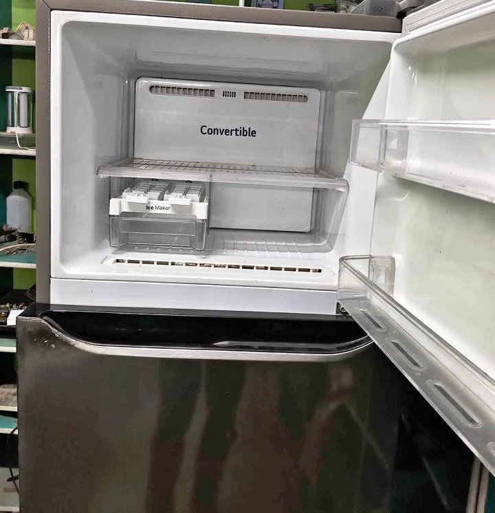 LG Refrigerator Convertible freezer compartment open, showing the interior shelf and built-in ice maker tray